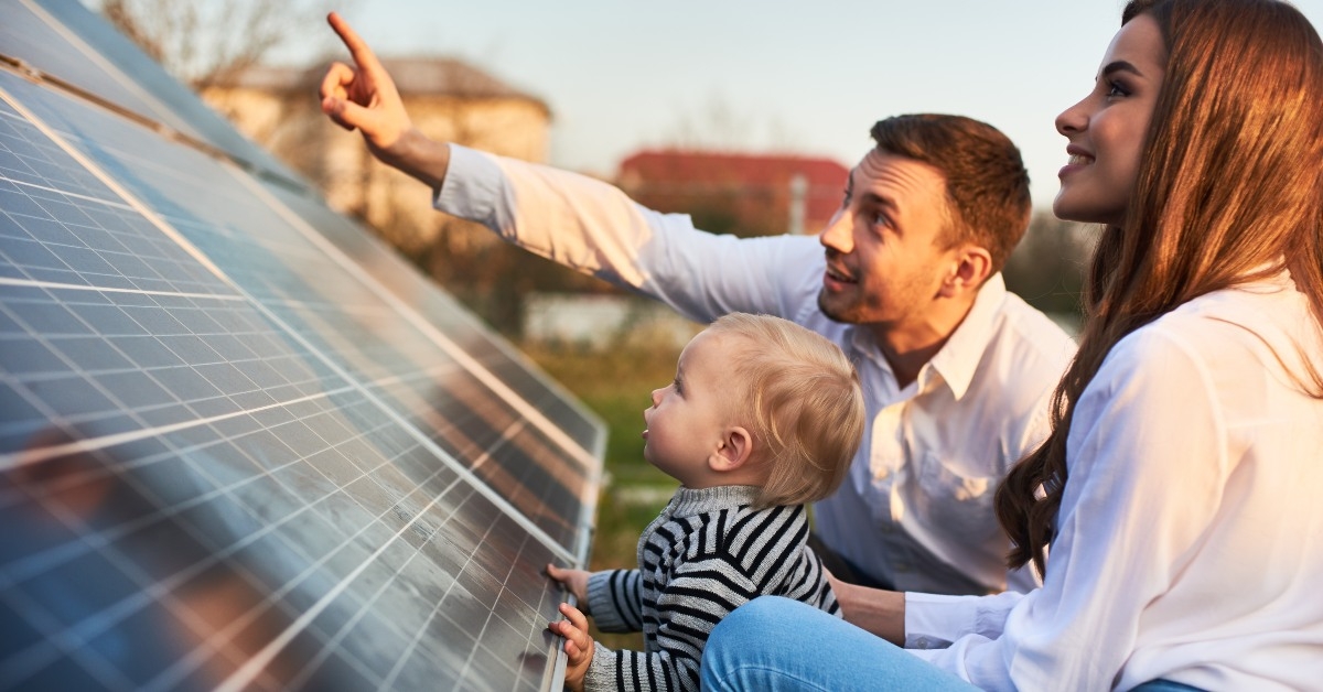Family looking at solar panels