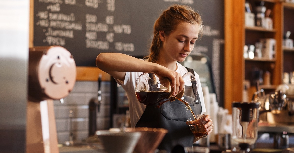 barista pouring coffee
