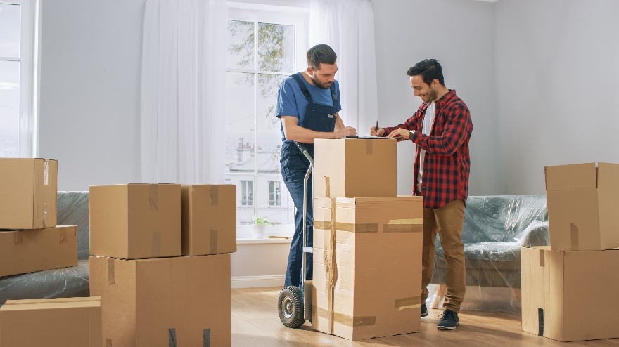 Mover with Hand Truck full of Cardboard Boxes