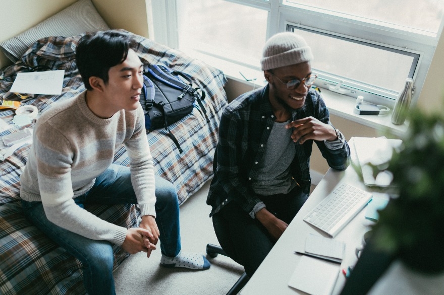 Friends watching a fun video on their computer