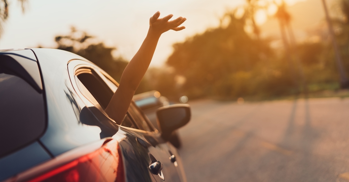 Hand out of car window