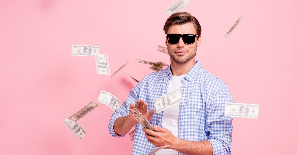 man throwing money