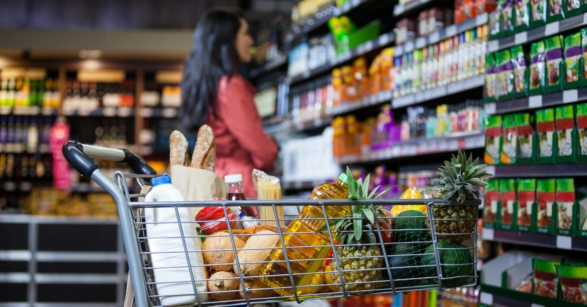 Woman looking at grocery store shelves