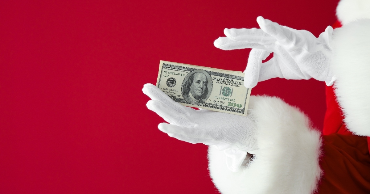Santa's hands holding money