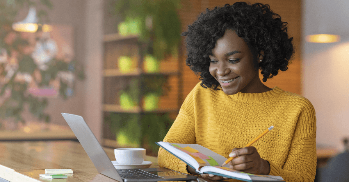Woman smiling at laptop