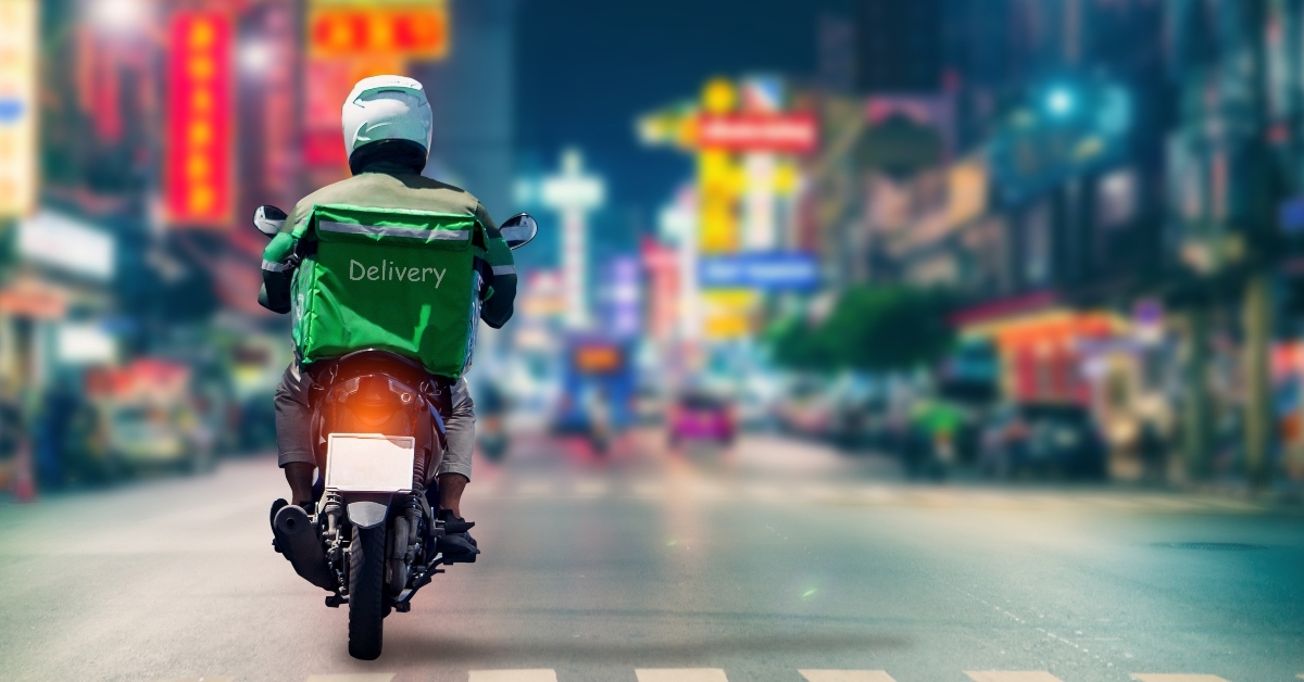 Delivery person on motorcycle