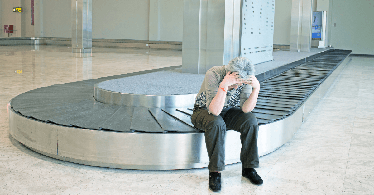 man waiting for luggage