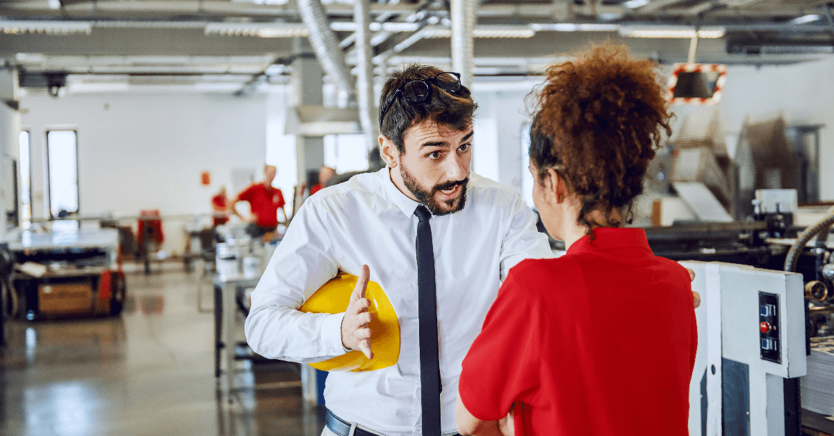 Angry boss arguing with his female employee