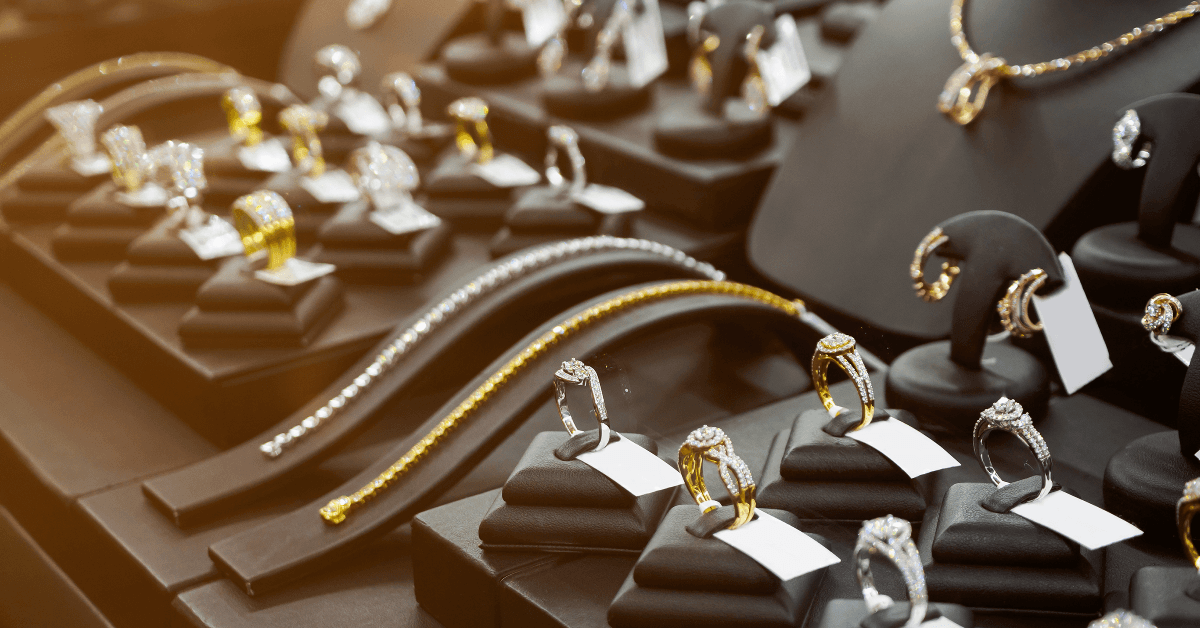Gold jewelry diamond shop with rings and necklaces luxury retail store window display