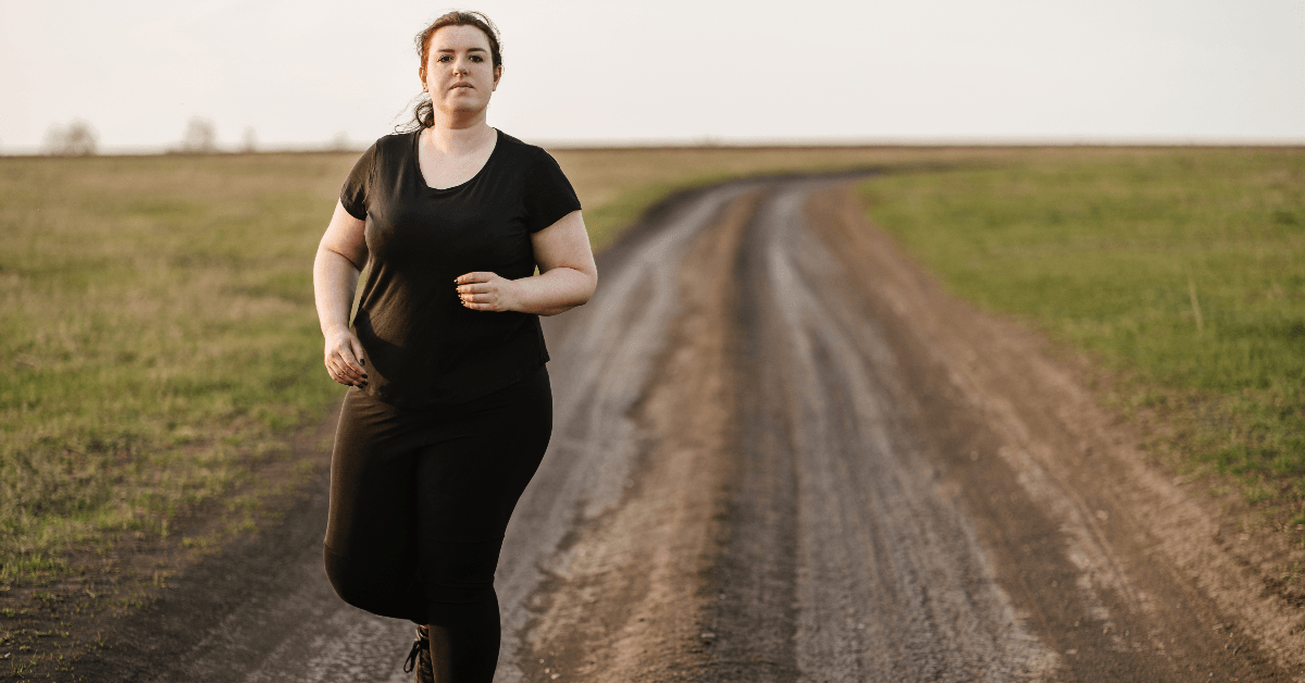 woman running on dirt road