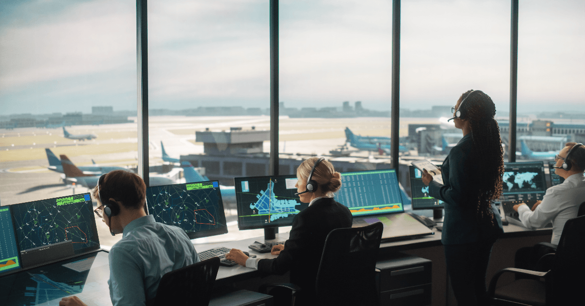 Air traffic control team in tower at airport
