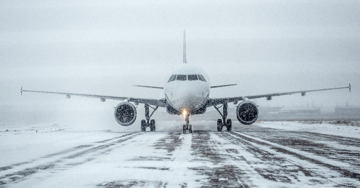 Airliner on runway in blizzard