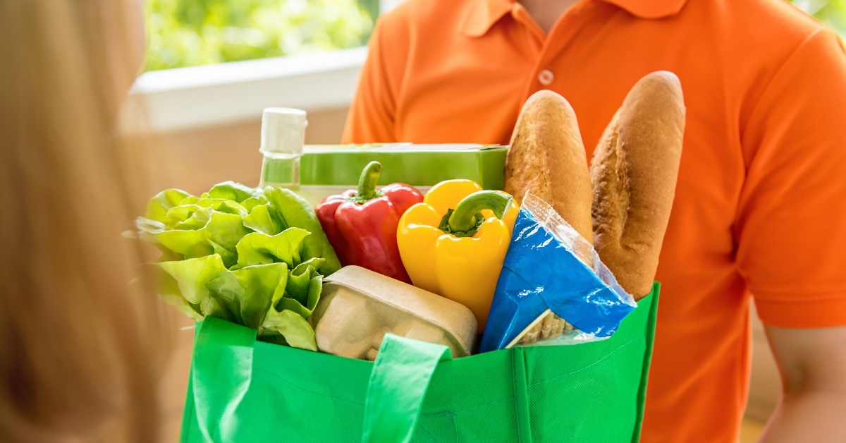 Man delivering bag of groceries