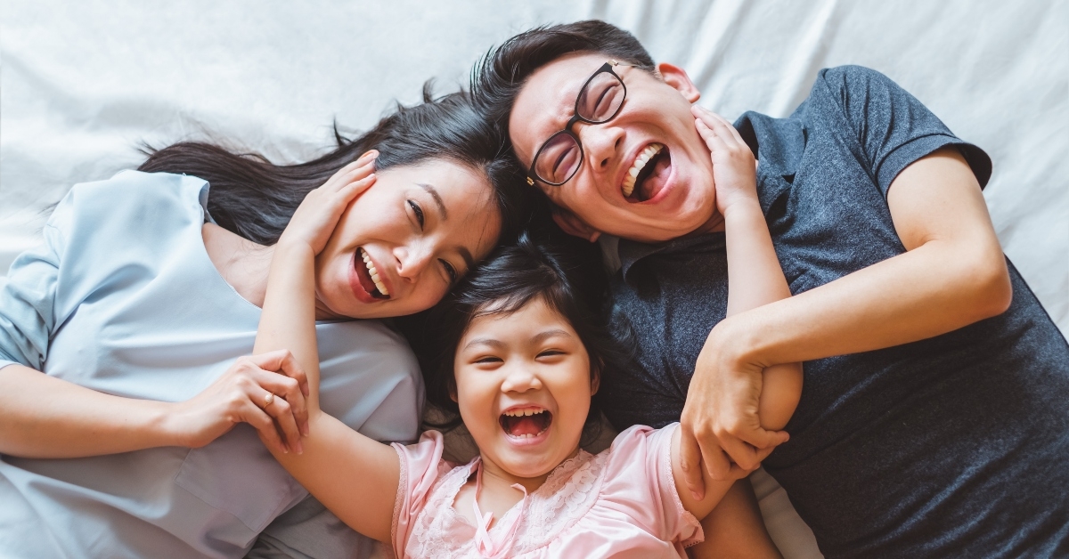 Happy family on bed