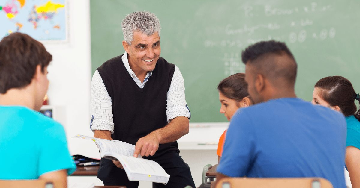 Teacher talking with students