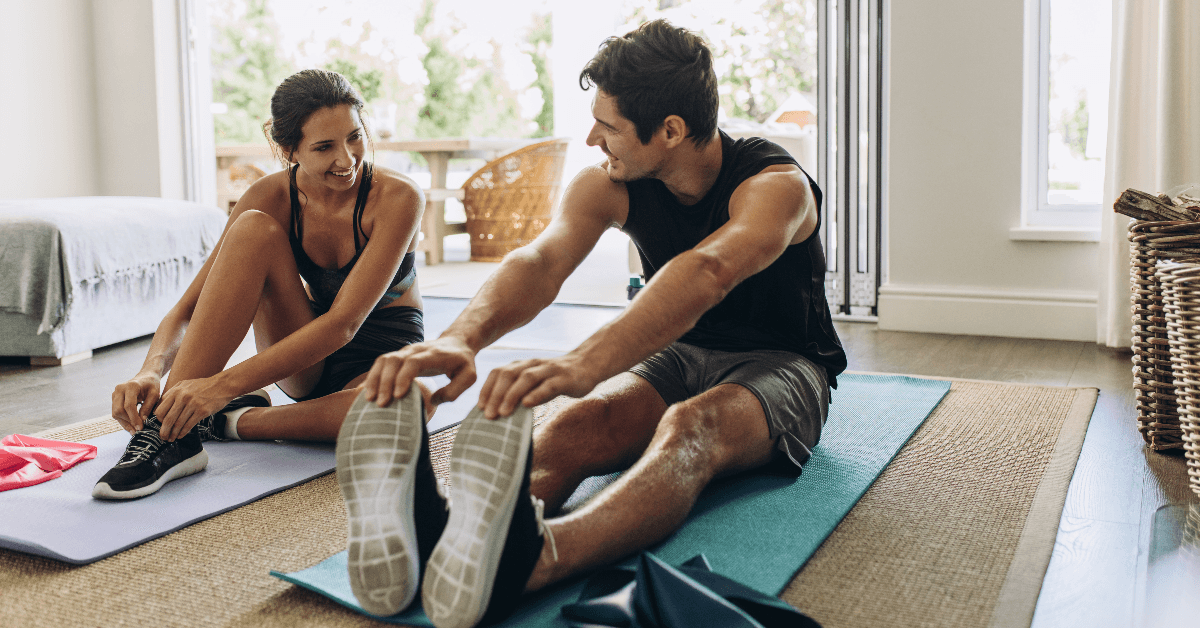 Couple exercising at home