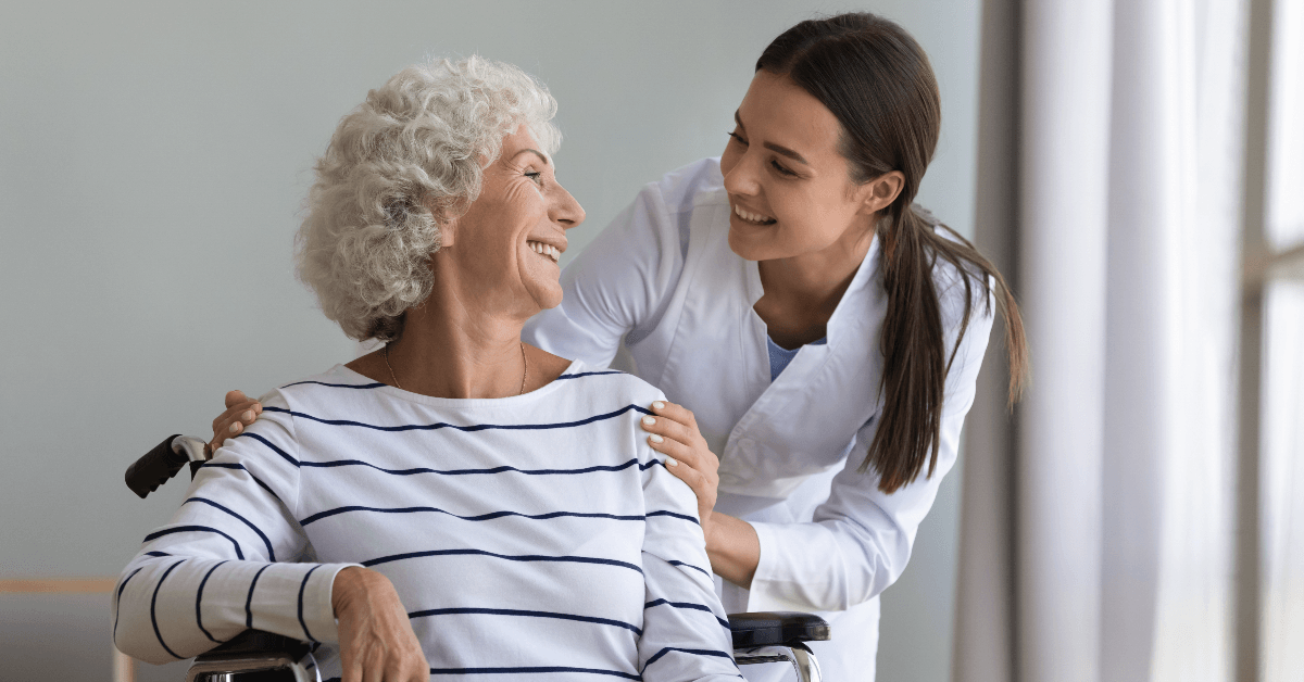 Woman in wheelchair talking to doctor