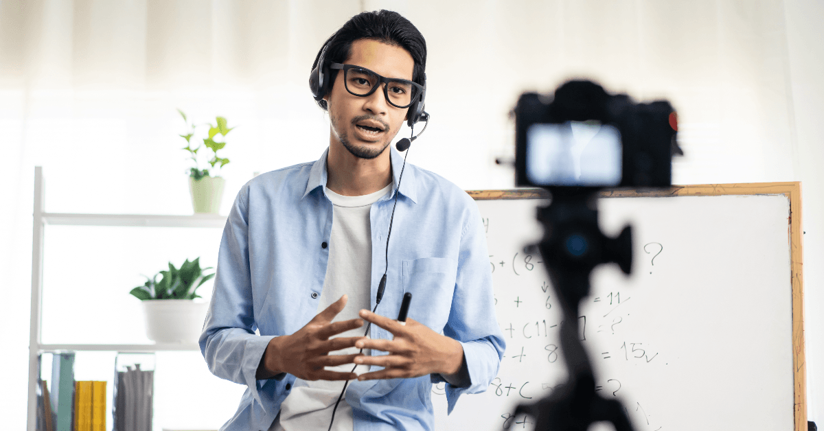 man filming online course