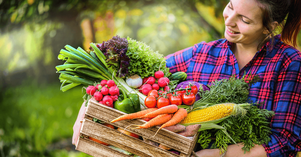 farmer with box of veggies