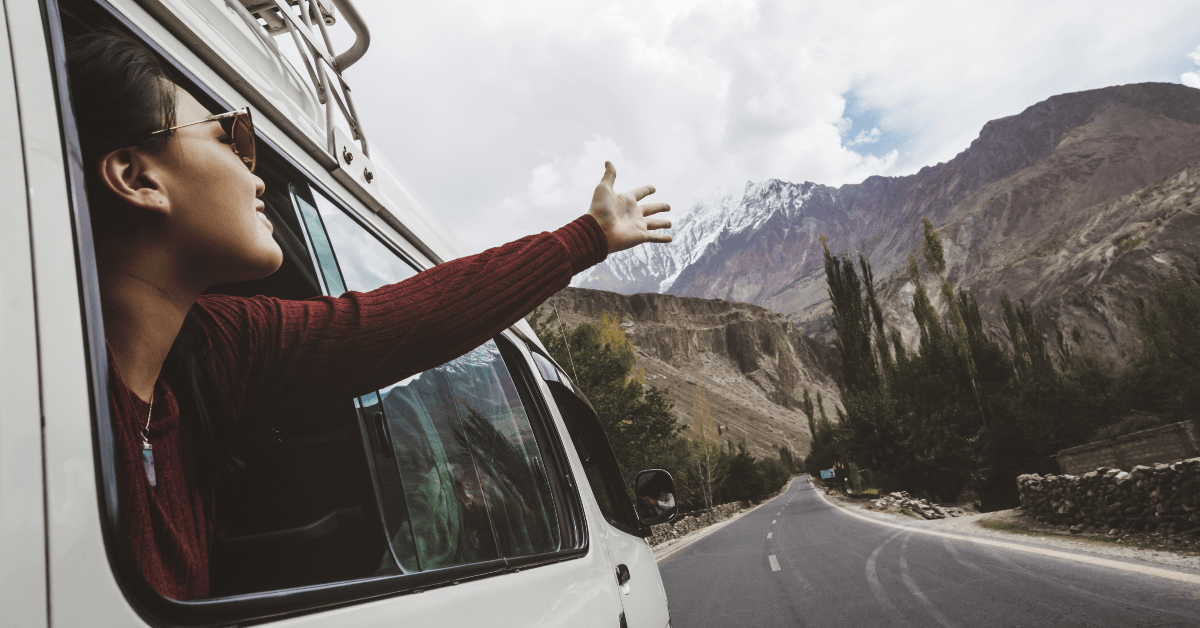 woman leaning out of van window