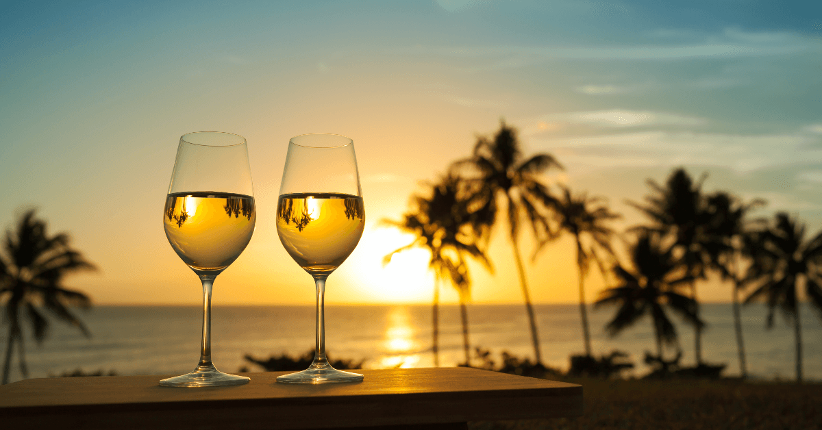 wine glasses by ocean view