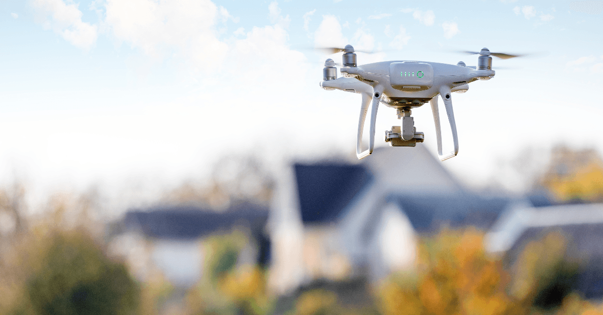 drone flying in front of home