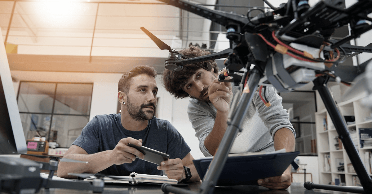 men working with drone