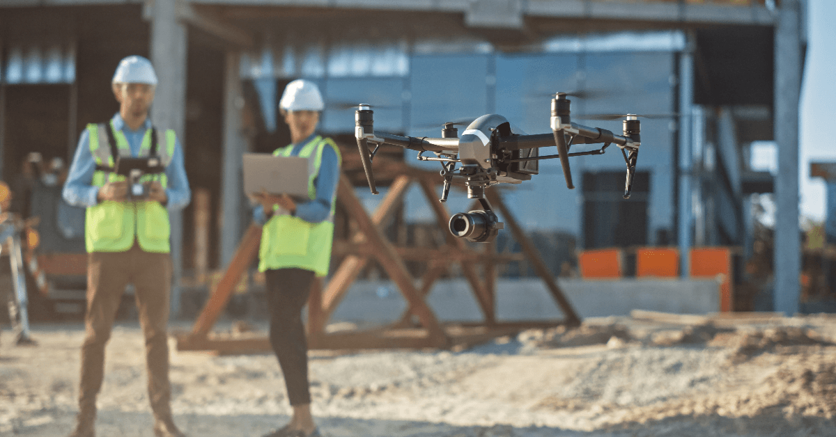 Construction site workers using drone for inspection