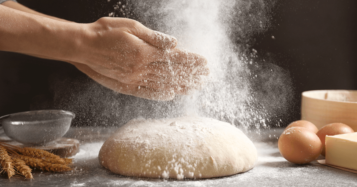 Person baking with flour