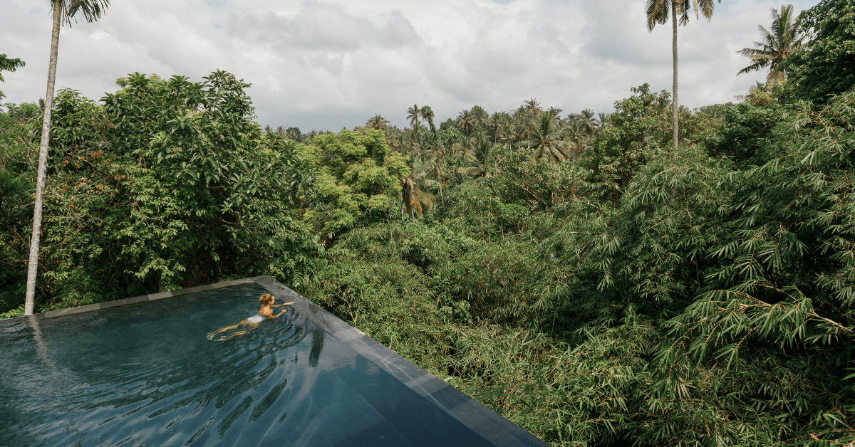 Person swimming in hotel pool