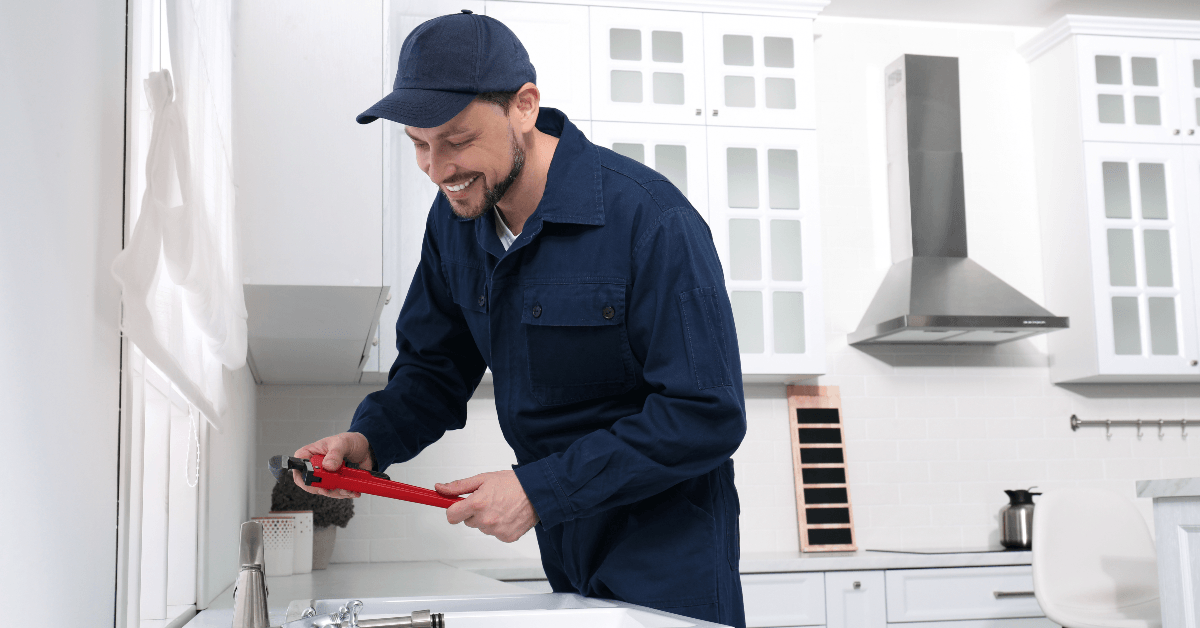 Man working on kitchen hardware