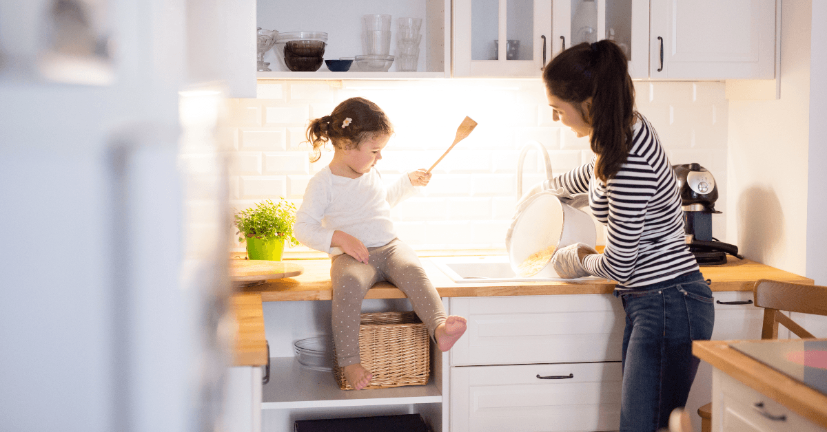 Mother and daughter cooking in kitchen