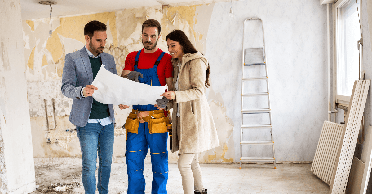 People looking at plans for home remodeling