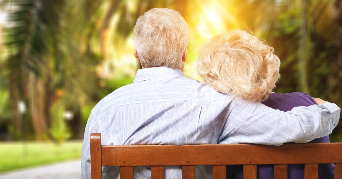 Senior couple on park bench