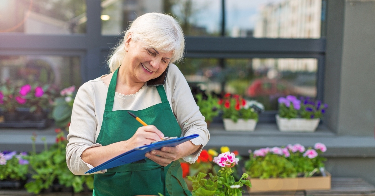 Senior woman working in florist shop