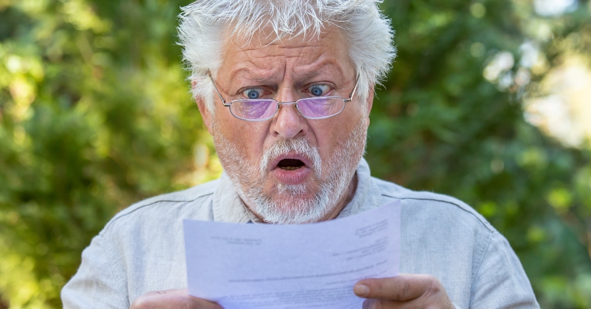 Shocked man read a subpoena