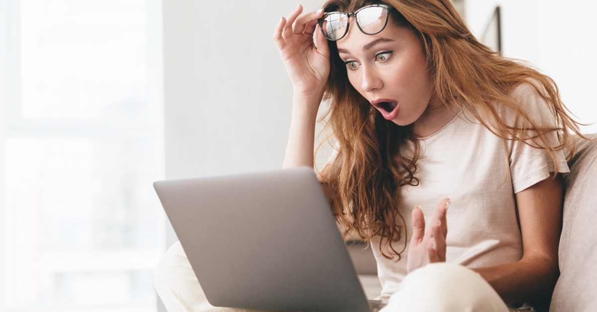 Shocked woman on laptop