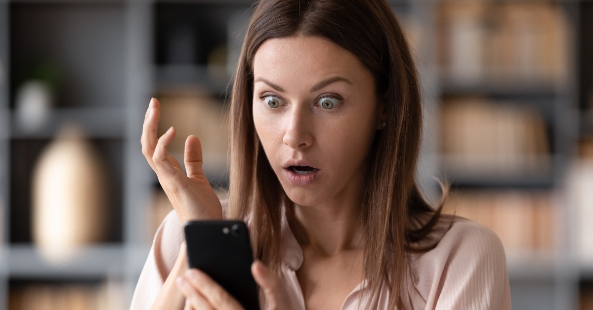 Shocked woman on phone