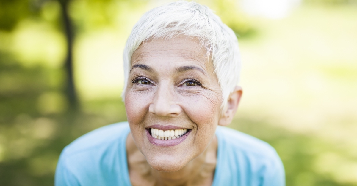 Smiling senior woman outside