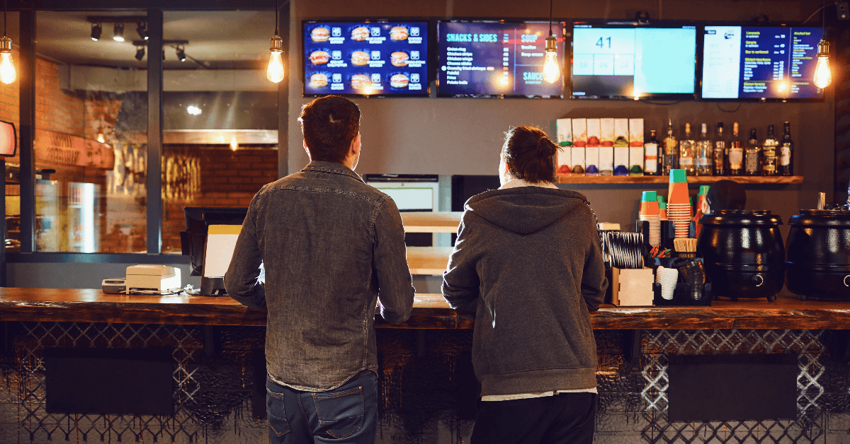 Two men ordering fast food
