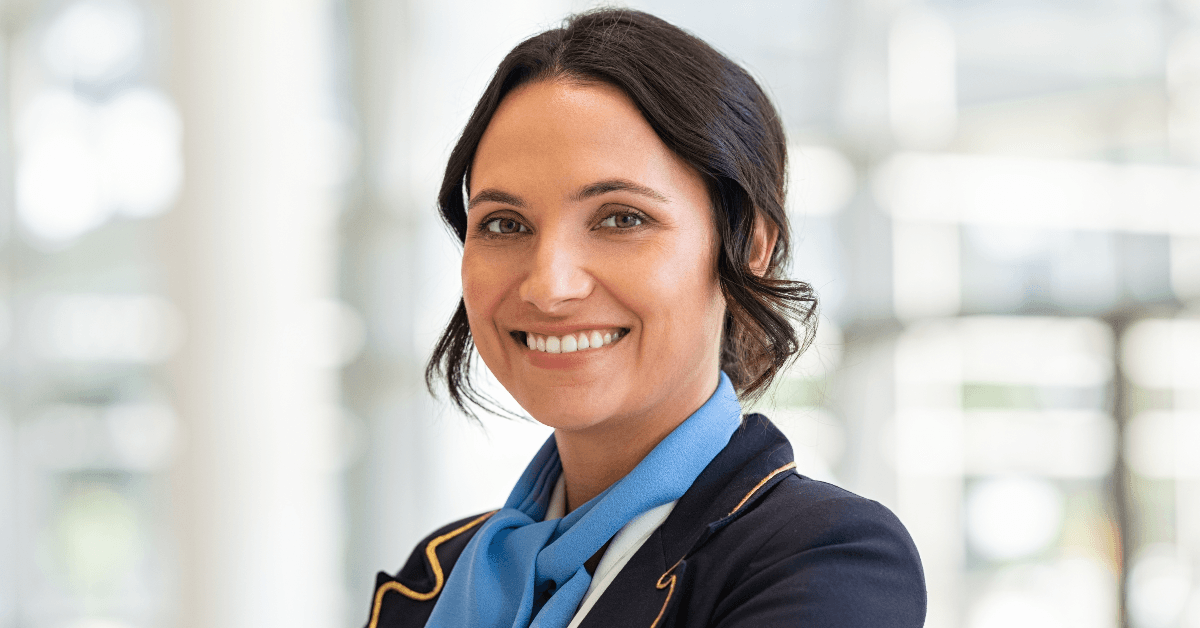 Female flight attendant smiling