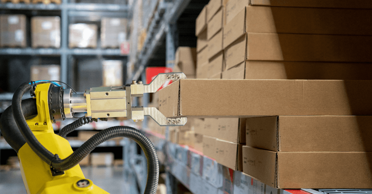 Robot arm grabbing package in warehouse