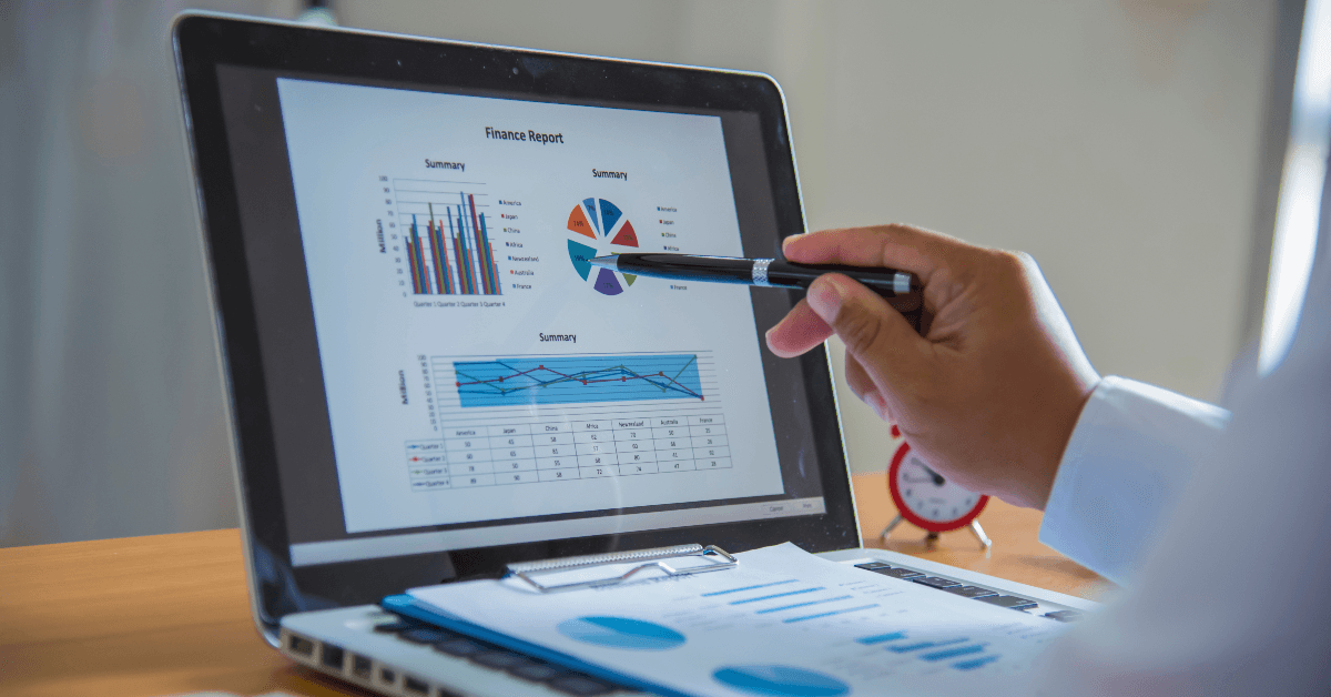 Person looking at graphs on computer