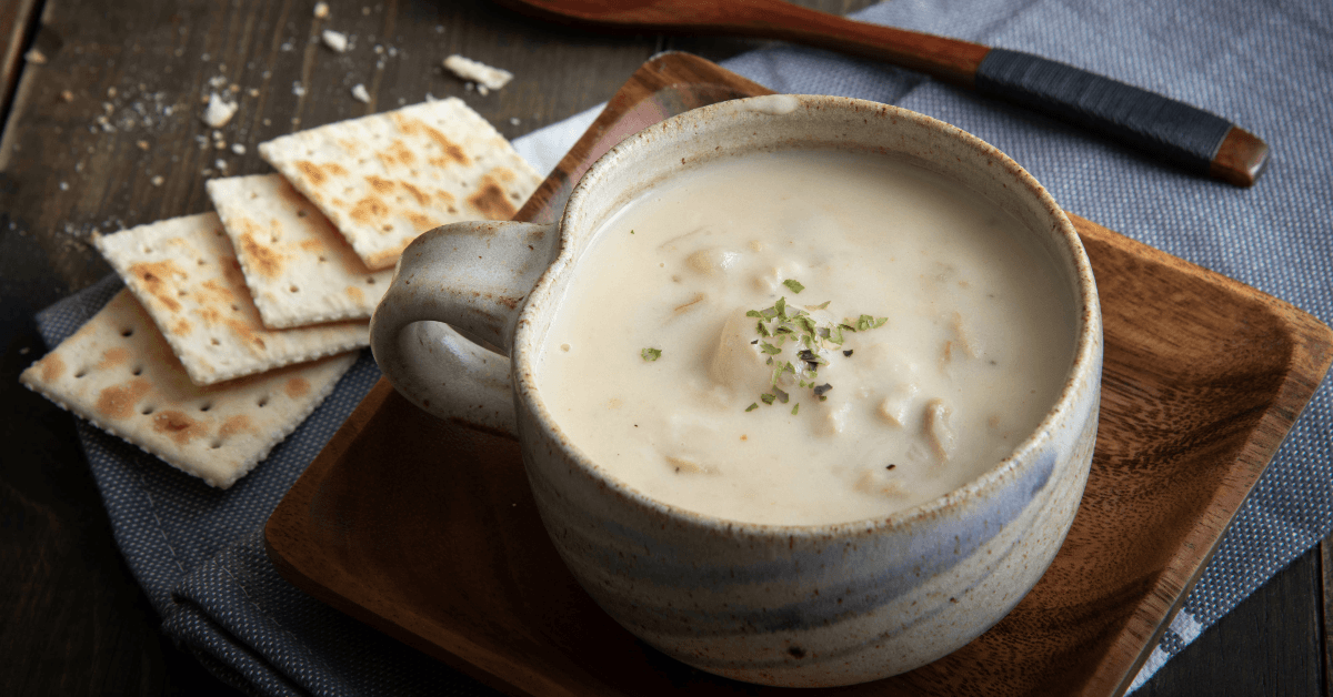 Bowl of clam chowder and crackers