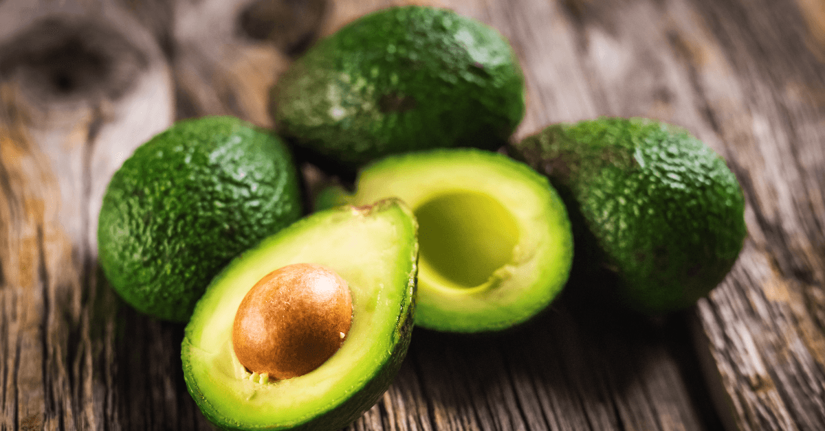 Cut and whole avocados