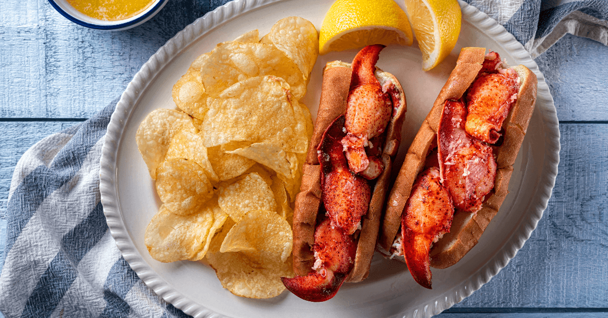 Lobster rolls and chips on plate