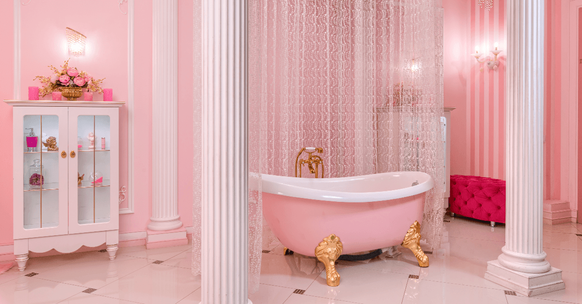 Fancy pink bathroom with claw foot tub