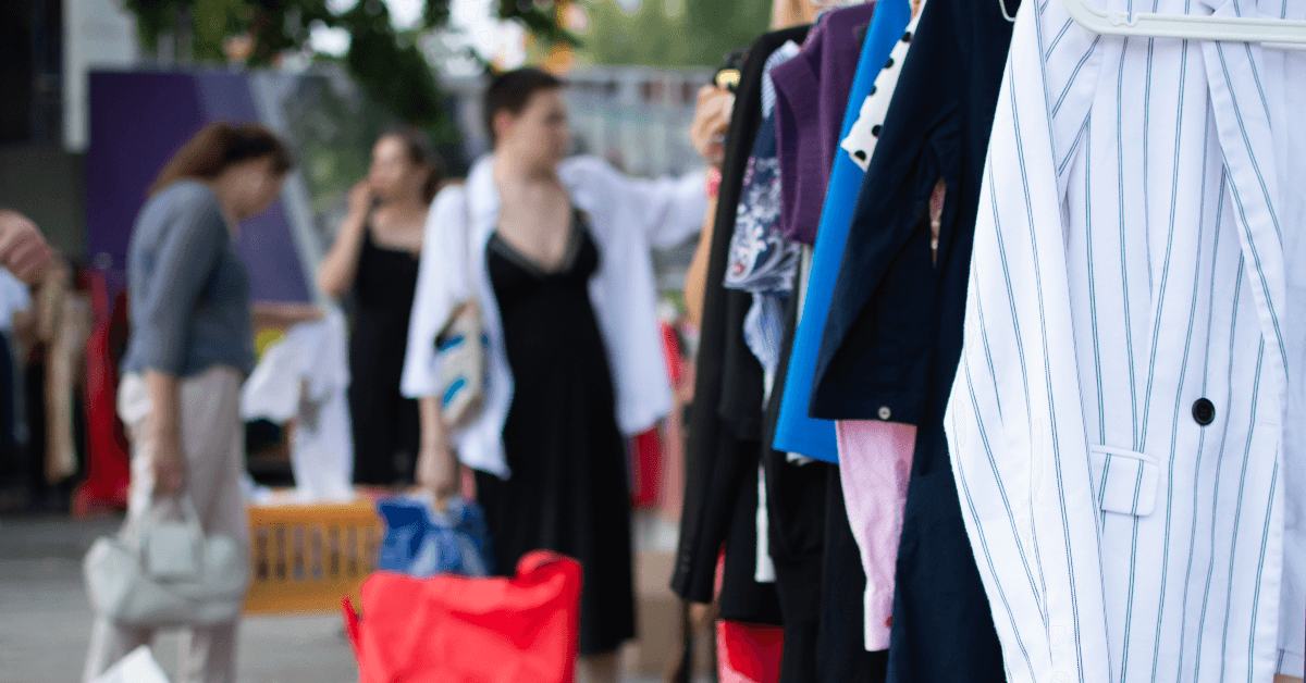 People looking at clothes at a yard sale