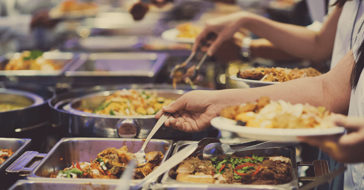 People getting food from a buffet