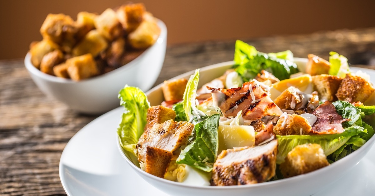 delicious caesar salad  with grilled chicken breast